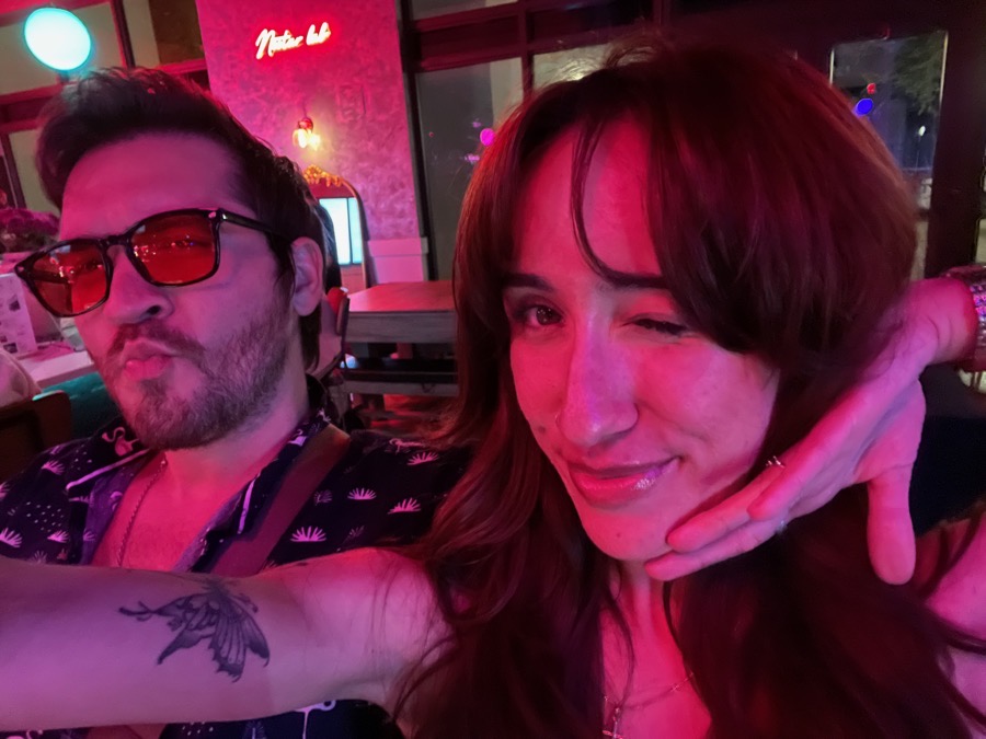 Matt and Laura under pink lights