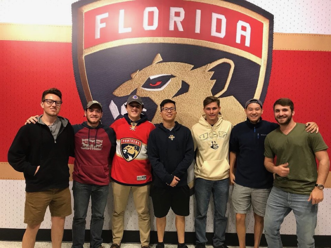 Matt with a group of guys at a Florida Panthers game